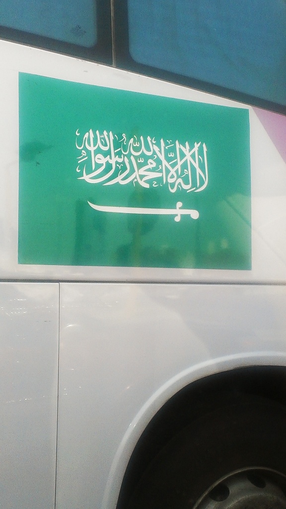 a bus sporting the Saudi flag